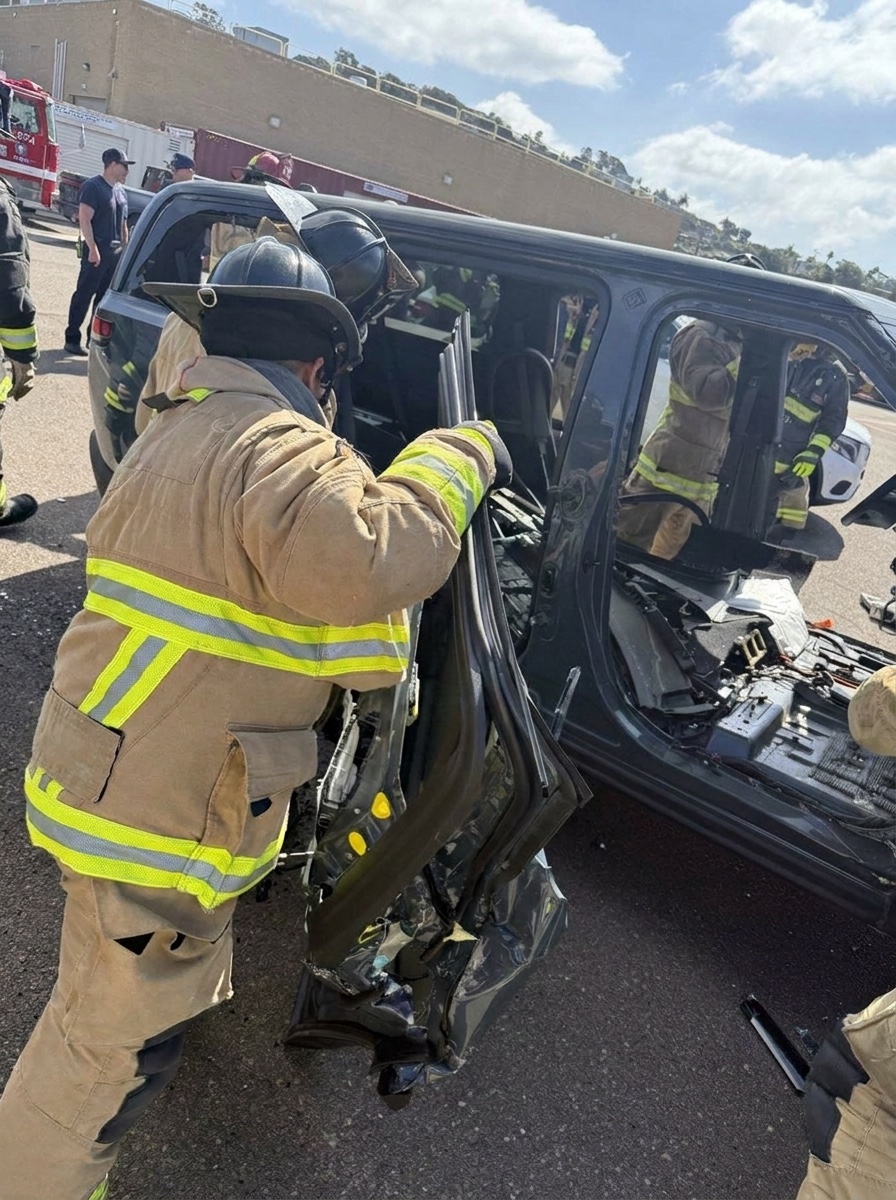 Firefighters performing a door removal