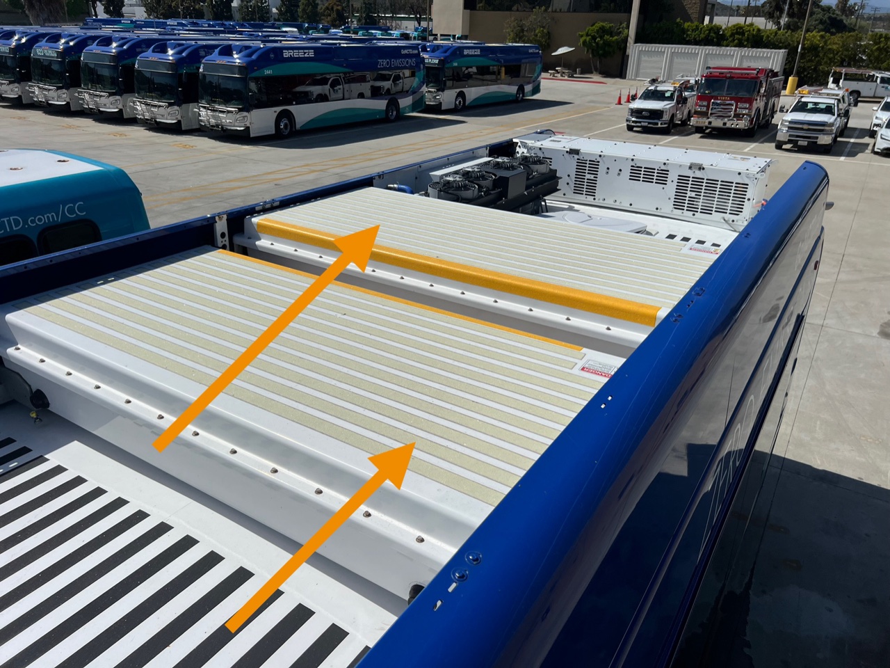 Annotated battery panels on an electric bus roof