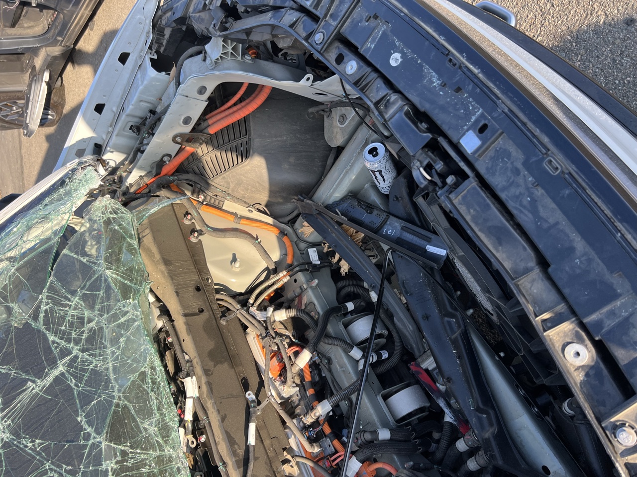 Exposed high-voltage cabling and components in a wrecked electric vehicle